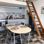 Dining area and ladder to loft